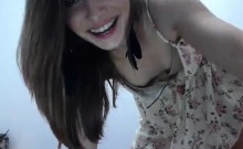 Alluring brunette teen in a sexy dress sensually flashes he