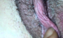 Fingering hairy pussy in close up video