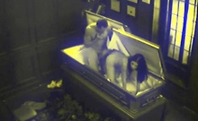 Slut fucks in coffin